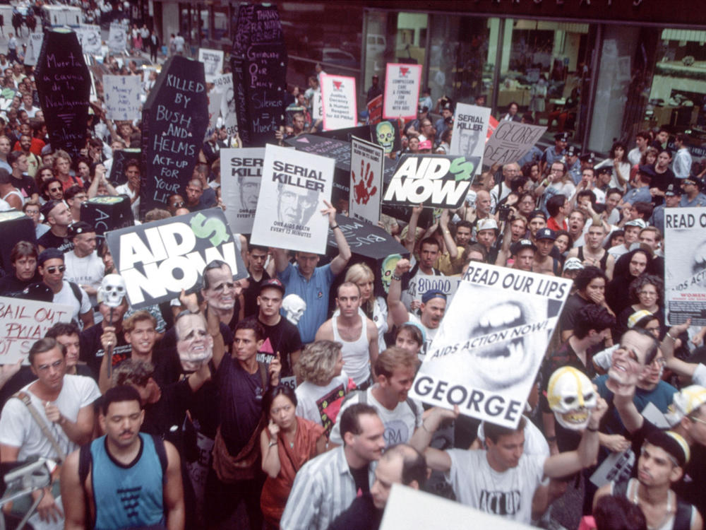 Demonstrators for AIDS research funds marched up New York's Madison Avenue on July 24, 1990, to protest President George Bush's policies on the disease.