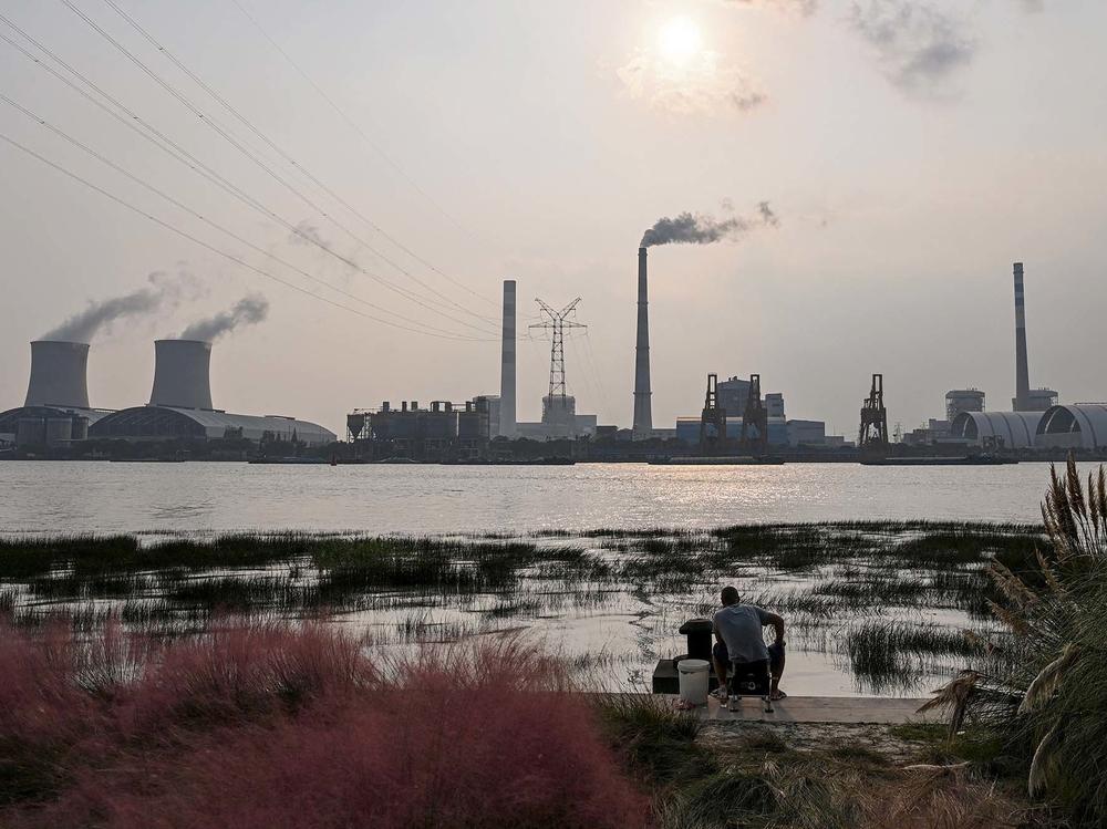 Scientists warn the world needs to dramatically reduce fossil fuel use, but many countries still depend on coal power, like from the Wujing Coal-Electricity Power Station in Shanghai, China.