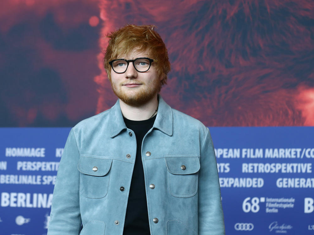 Ed Sheeran, pictured in 2018 at the Berlin International Film Festival, says he has tested positive for the virus that causes COVID-19 just days ahead of the release of his fourth album.