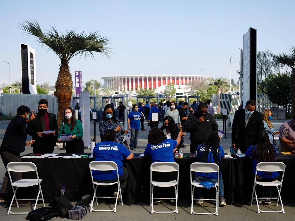 Los Angeles International Airport and SoFi Stadium employers spoke with potential job applicants at a job fair in Inglewood, Calif., in September. About 19% of all households in an NPR poll say they lost all their savings during the COVID-19 outbreak, and have none to fall back on.