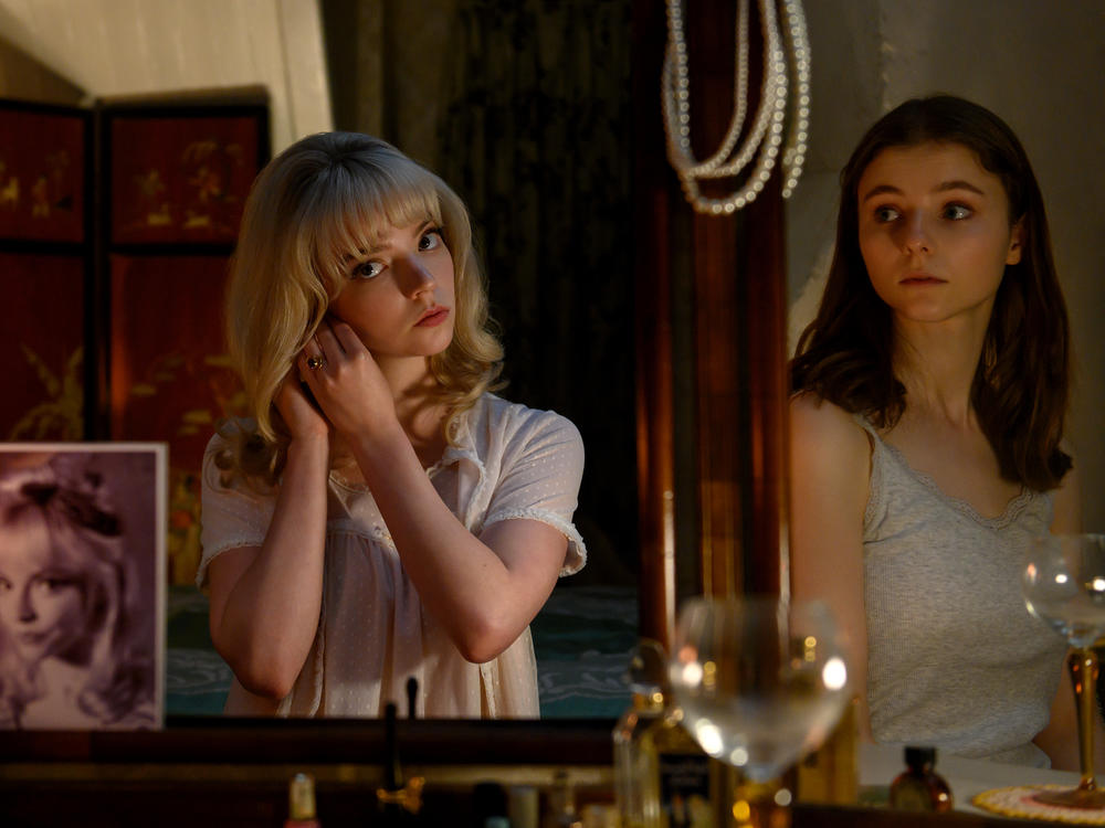 Sandie (Anya Taylor-Joy) and Eloise (Thomasin McKenzie) merge minds, bodies and fashion senses in<em> Last Night in Soho.</em>