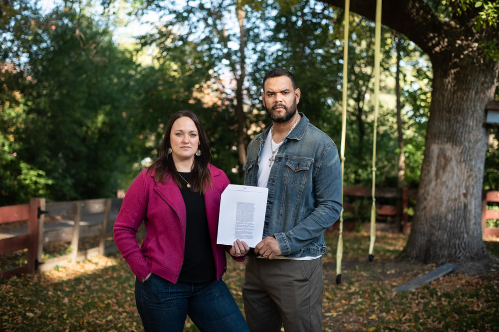 Maria and Miguel Cisneros hold the deed for their house in Golden Valley. She wanted the racial covenant removed immediately and went to the county recorder's office. What she thought would be a simple process actually was cumbersome, expensive and time-consuming.