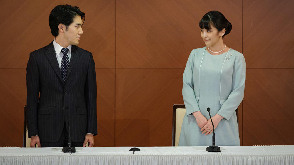 Princess Mako, the elder daughter of Prince Akishino and Princess Kiko, and her husband Kei Komuro, a university friend of Princess Mako, pose during a press conference to announce their wedding at Grand Arc Hotel on Oct. 26, 2021 in Tokyo.