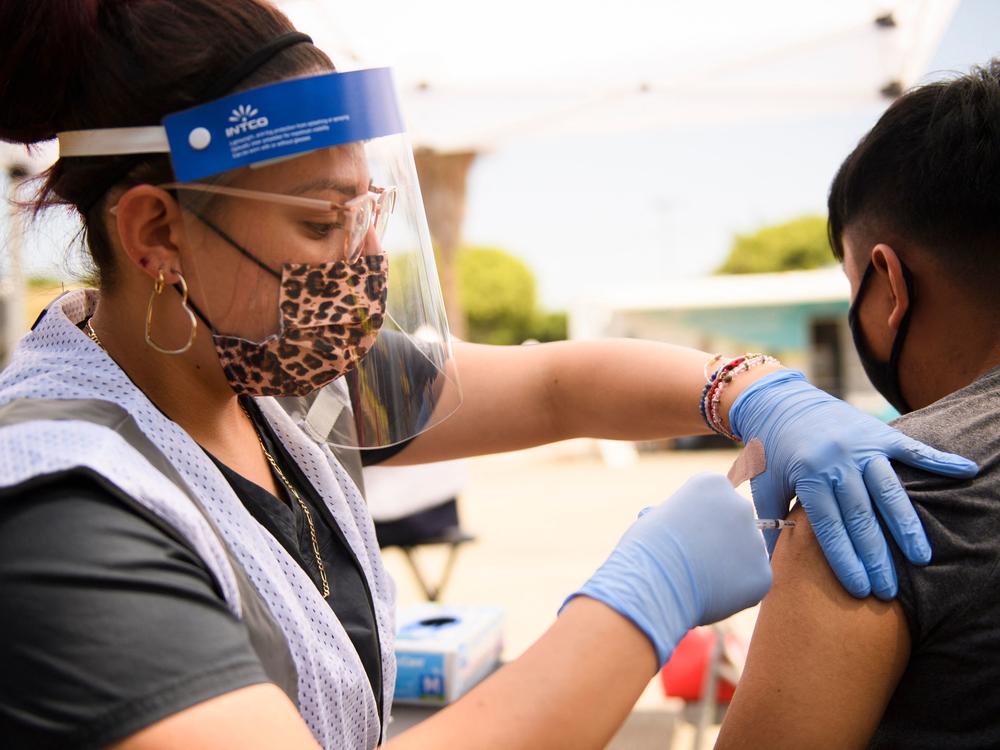 FDA may soon authorize the Pfizer COVID-19 vaccine for kids ages 5 to 11. Teens, like the 17-year-old pictured, are already eligible for the vaccine.