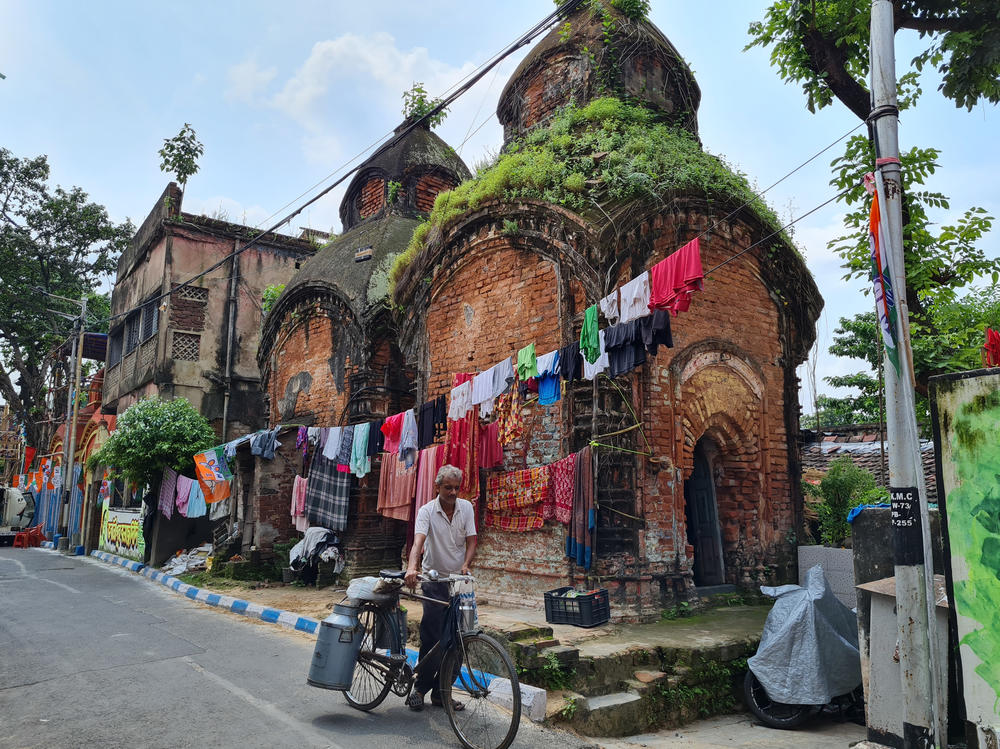 Flags of Mamata Banerjee's All India Trinamool Congress party alongside laundry hanging in Banerjee's own neighborhood in central Kolkata, India.