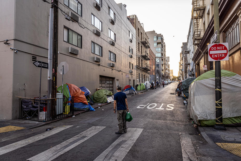 Homeless people living in tents line a side street in the Tenderloin district. More than 40% of all drug overdoses are in the Tenderloin and neighboring SOMA district, according to city data.