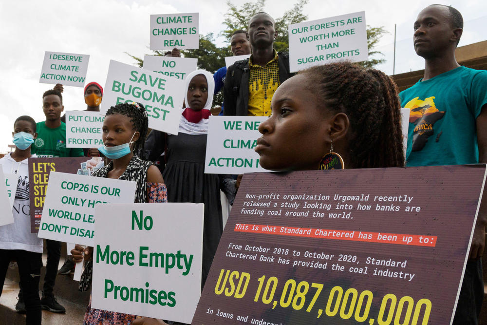 Nakabuye, second from right, and other activists hold signs bearing climate change-related messages directed toward the Ugandan government. The protest, which was organized by Nakabuye's group, Fridays for Future Uganda, took place at Kampala International University in Uganda in March.