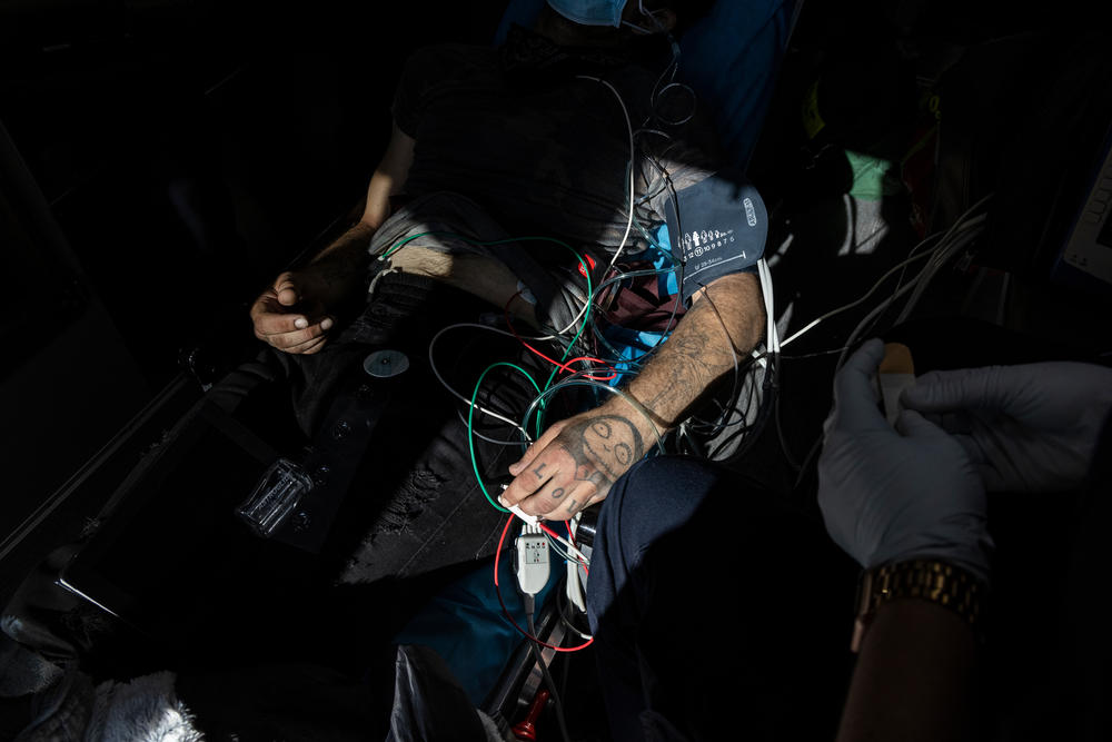 A man named Nicholas gets care in an ambulance after overdosing in San Francisco, Calif.