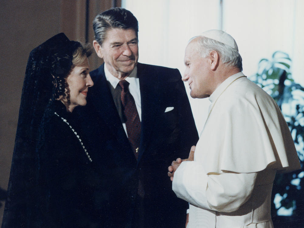In this June 7, 1982 file photo, President Ronald Reagan and his wife Nancy Reagan meet Pope John Paul II at the Vatican.