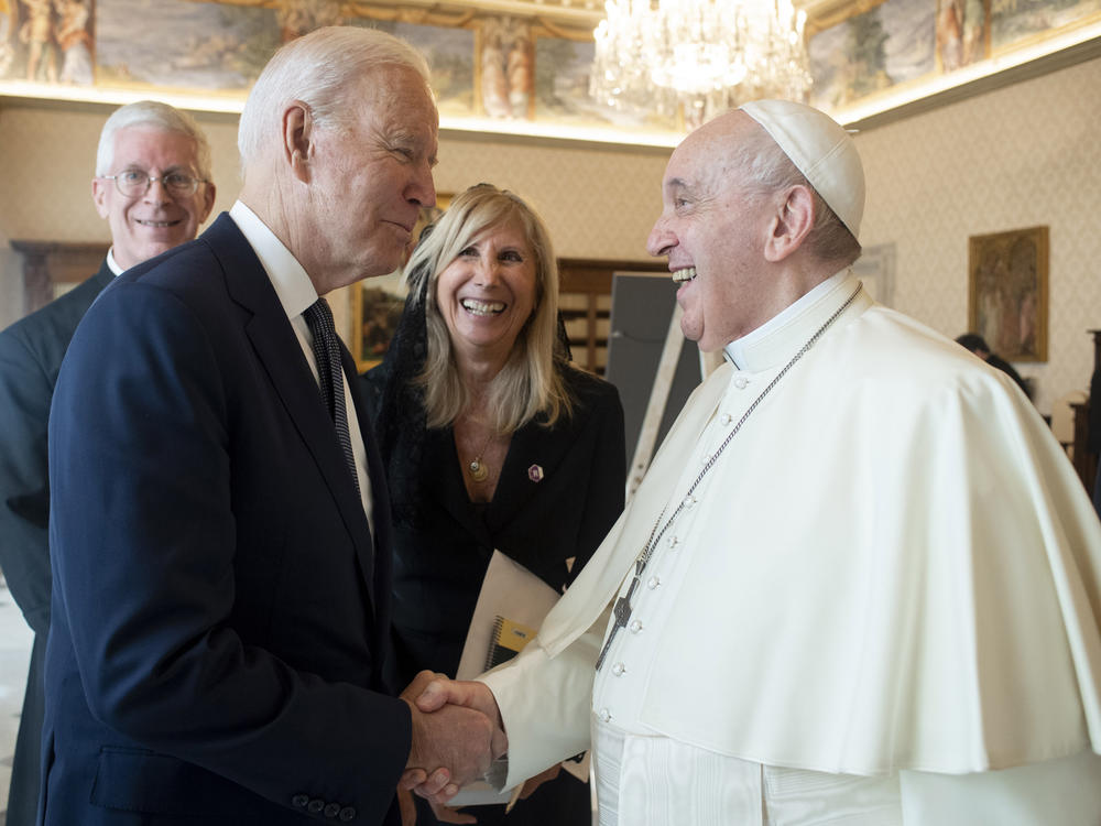 President Biden shakes hands with Pope Francis at the Vatican on Friday. The pontiff called Biden a good Catholic.