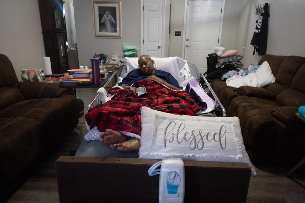 Nunny Reece, 42, falls asleep while in at-home hospice care in her home in Hope Mills, N.C. Nunny struggles with staying awake, speaking and moving about as her cancer has progressed significantly. COVID-19 protocols have resulted in her receiving very few visitors during her hospice care.