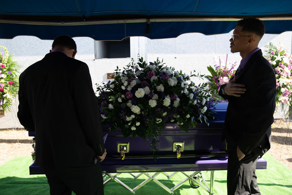 Nunny Reece's oldest sons, Tylan (left) and Tavon (right) pay their respects to their mother. Nunny died on Feb. 1, 2021 — nine days before her 43rd birthday. Her funeral service embodied what she loved: God, her family and the color purple. The home-going service was preplanned. Nunny picked out the worship songs, speakers and decorations she wanted before she died.