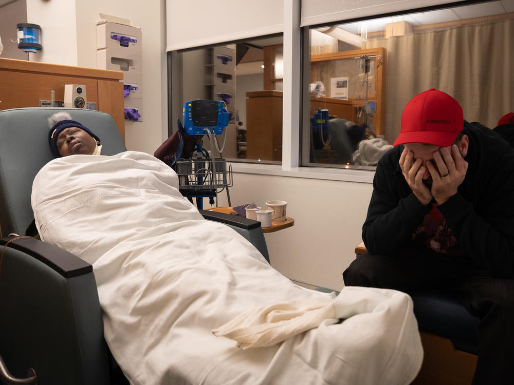 Nunny Reece lays back during chemotherapy while her husband, Scott, waits at the N.C. Cancer Hospital. When Nunny and Scott were informed by a doctor about her diagnosis, 