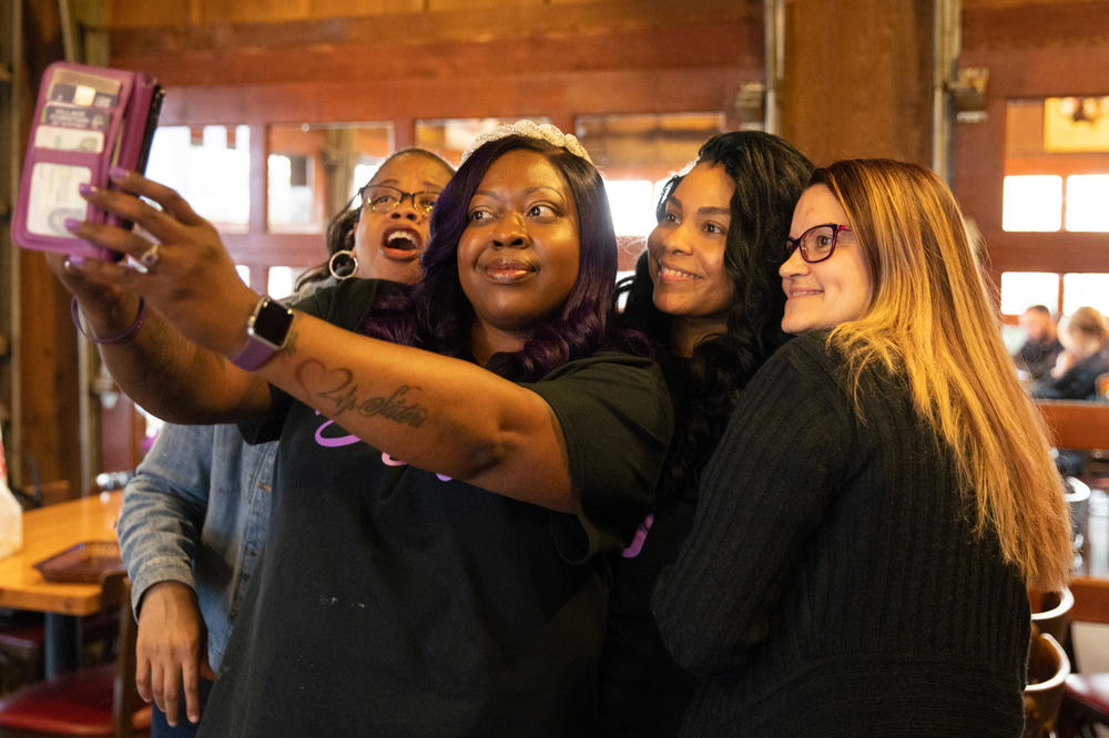 Nunny Reece celebrates with her sister, Tauneka Roundtree Dolloson (left), best friends Tedra Harris (right) and Jessica Clark (far right) at Nunny's bridal shower. The trio helps Scott take care of Nunny by keeping her company and taking her to appointments when he cannot.