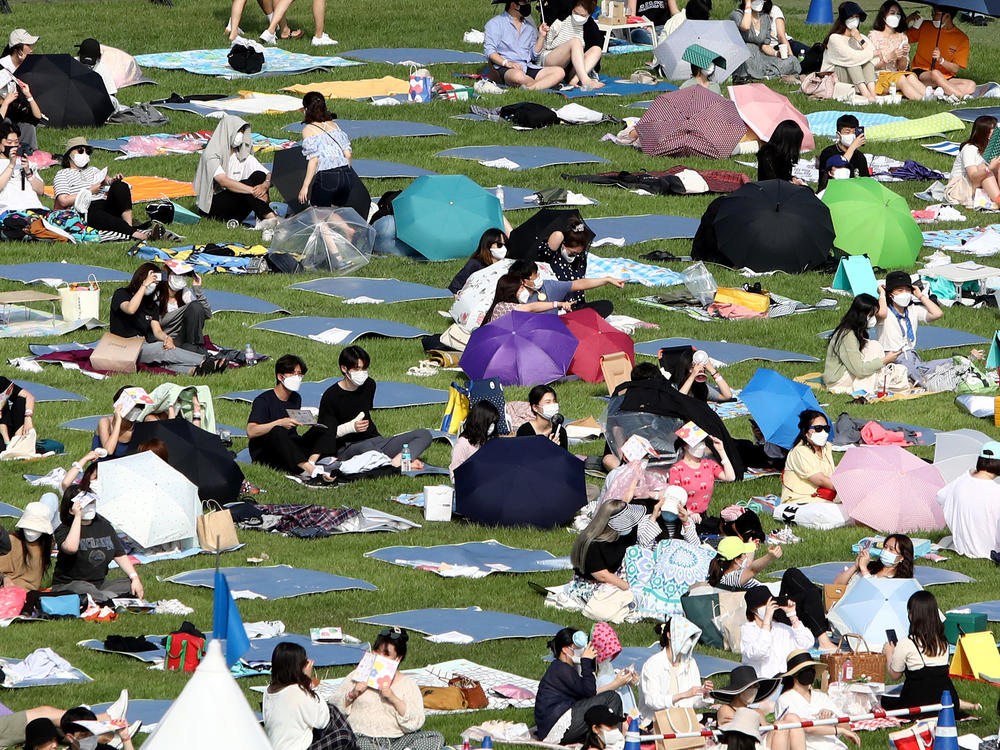 Festivalgoers attend a music festival at Olympic Park on June 26, 2021 in Seoul, South Korea.