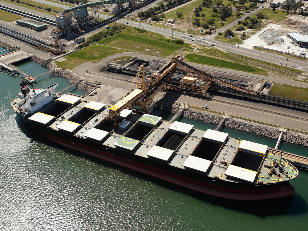 A bulk carrier is loaded with coal at the Newcastle Coal Terminal in this aerial photograph taken in Newcastle, Australia in 2015.