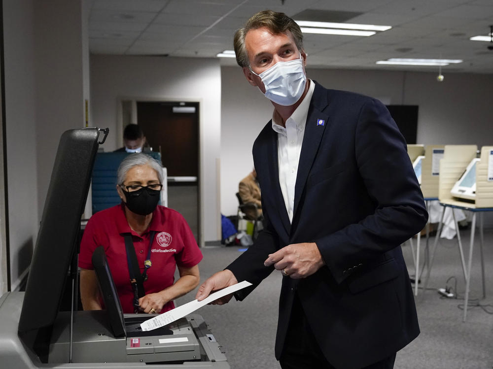 Virginia Republican gubernatorial candidate Glenn Youngkin casts his ballot early, in September. Youngkin has walked a tight rope on voting issues ahead of Tuesday's election.