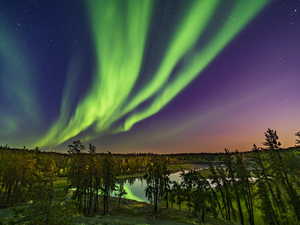 The northern lights can be seen from the Cameron River viewpoint off the Ramparts Falls trail on the Ingraham Trail near Yellowknife, Canada.