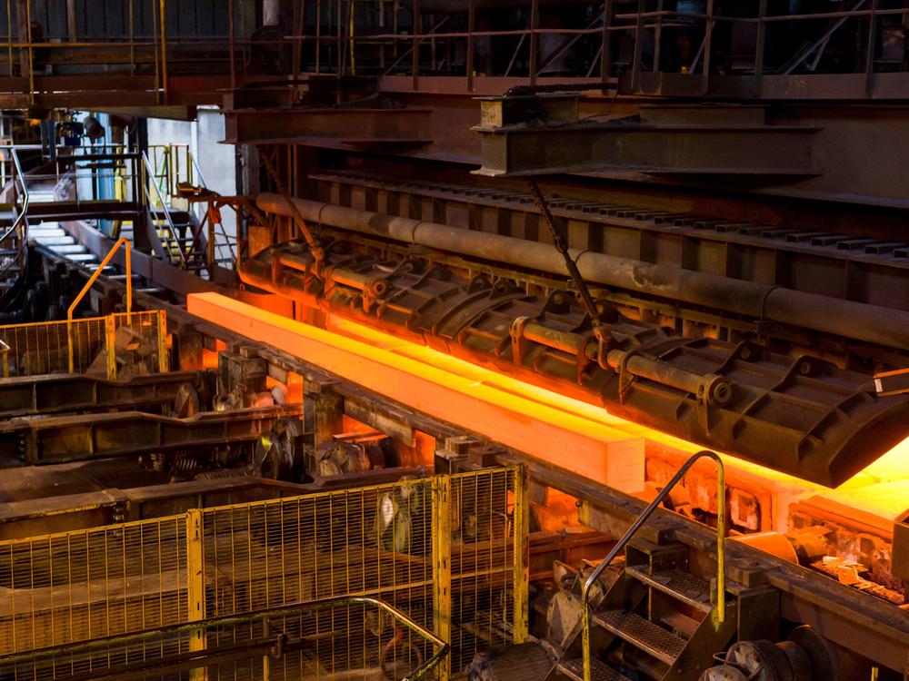 Steel ingots emerge from an oven at the Saarsthal rail plant in Hayange, France, on Sept. 13, 2021. The United States and European Union have reached a deal on steel and aluminum tariffs.