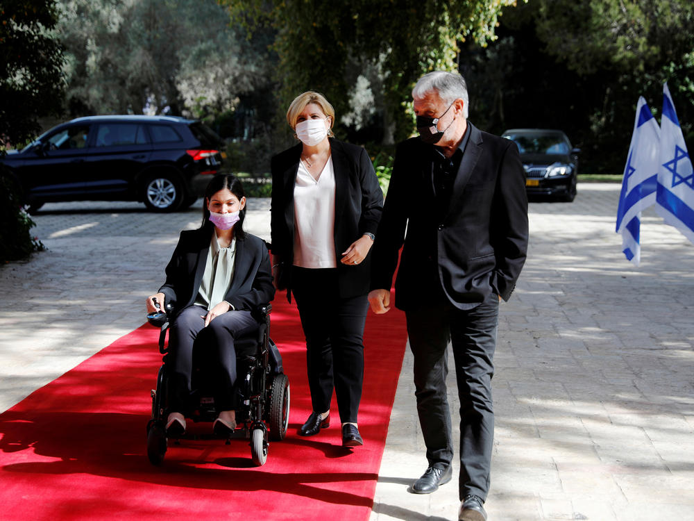 Karine Elharrar, Orna Barbivai and Meir Cohen from the Yesh Atid party arrive for consultations on the formation of a coalition government in Jerusalem on April 5, 2021.
