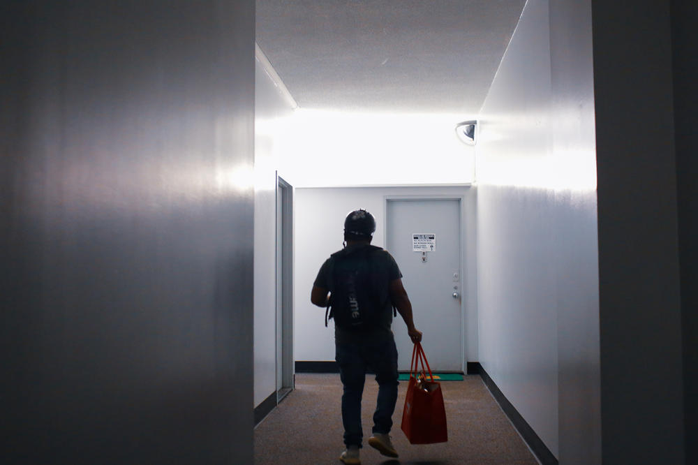 Gustavo Ajche wants people ordering food to know workers are moving as fast as they can.