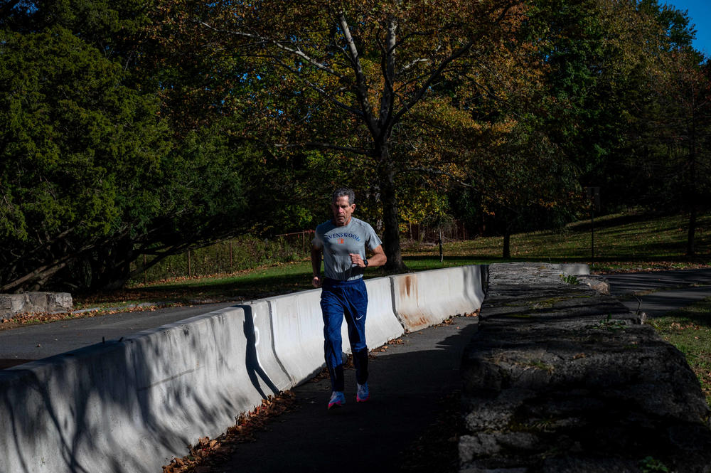 Larry Trachtenberg jogs through Bruce Park in Greenwich, Conn.