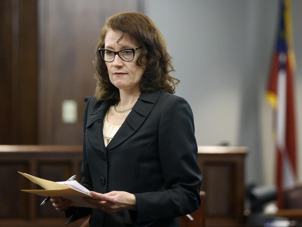 Prosecutor Linda Dunikoski gestures as she speaks during jury selection at Glynn County Superior Court. The court called up to 1,000 prospective jurors to ultimately choose a panel of 16 to hear the case.