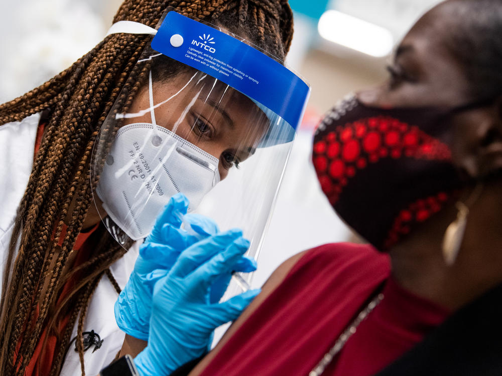 Hattie Pierce, 75, receives a Pfizer covid-19 vaccine booster shot from Dr. Tiffany Taliaferro at the Safeway on Capitol Hill in Washington, D.C., on Monday, October 4, 2021.