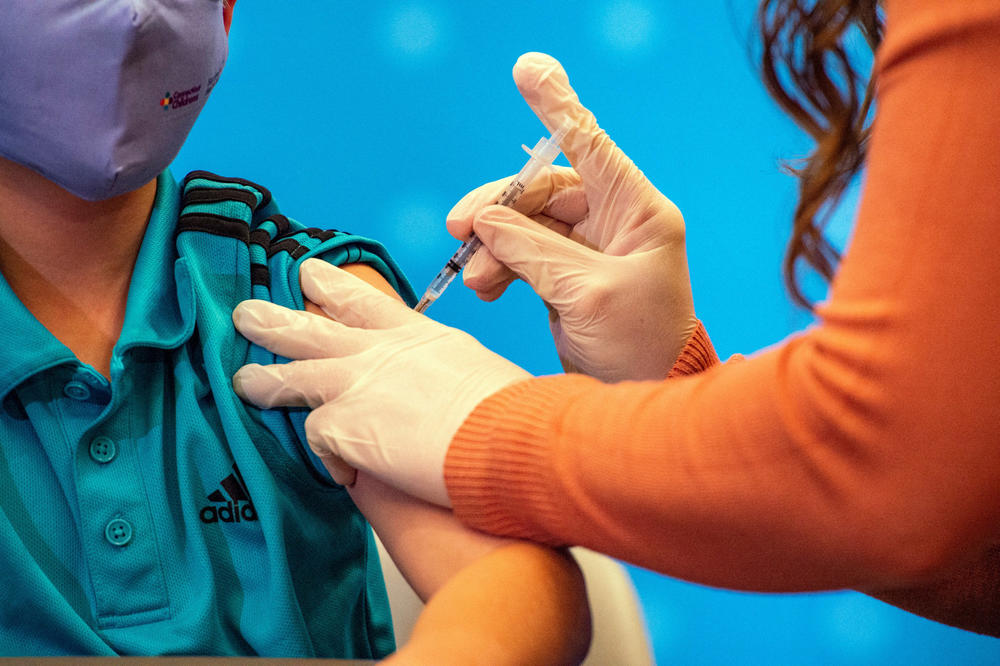 A 10-year-old child receives the Pfizer-BioNTech Covid-19 Vaccine for 5- to 11-year-old kids at Hartford Hospital in Hartford, Connecticut on November 2, 2021.
