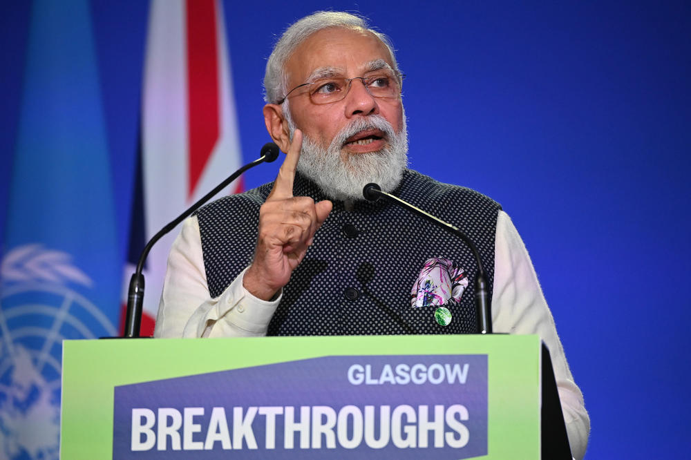 India's Prime Minister Narendra Modi speaks during a session at COP26 in Glasgow on Tuesday. He surprised delegates at the U.N. climate summit this week with bold new promises on renewable energy and carbon neutrality.