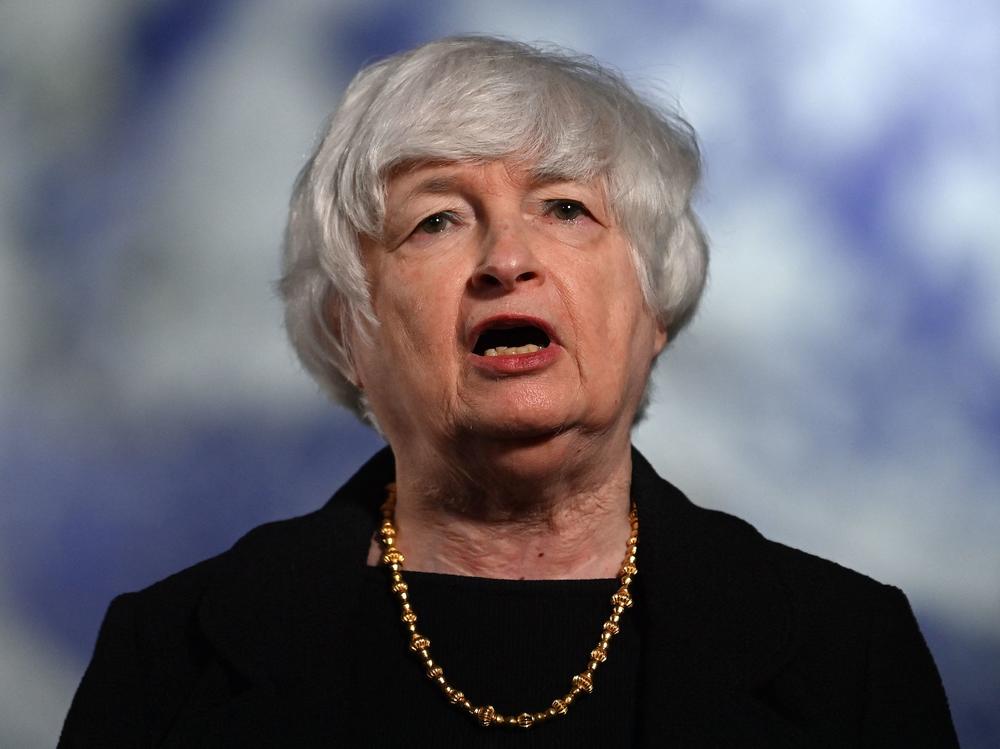 Treasury Secretary Janet Yellen speaks to the press during the COP26 U.N. Climate Summit in Glasgow, Scotland, on Wednesday. In an interview with NPR's <em>Morning Edition</em>, Yellen said she expects inflation will moderate by next year. She also called on the private sector to do more to fight climate change.