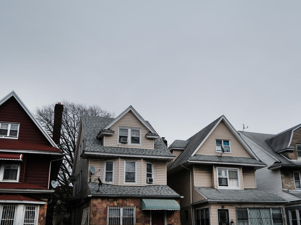 Homes line the street of a neighborhood in Brooklyn, N.Y., in March. Zillow announced it will stop buying and reselling homes, citing the volatility of the housing market.