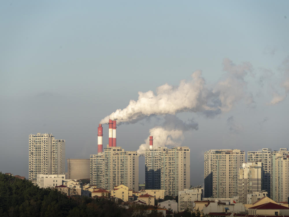 Smokestacks belch in Weihai, in China's Shandong province, in 2019. China is set to surpass pre-pandemic levels of carbon dioxide emissions this year.
