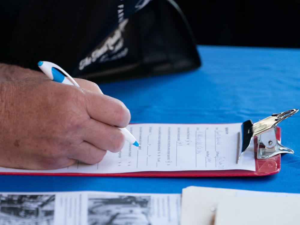 A man fills out an application at a booth at the Employers Only Long Island Food, Beverage and Hospitality Job Fair on Oct. 19 in Melville, N.Y. Employers added 531,000 jobs in October, marking a recovery after two months of weaker job growth.