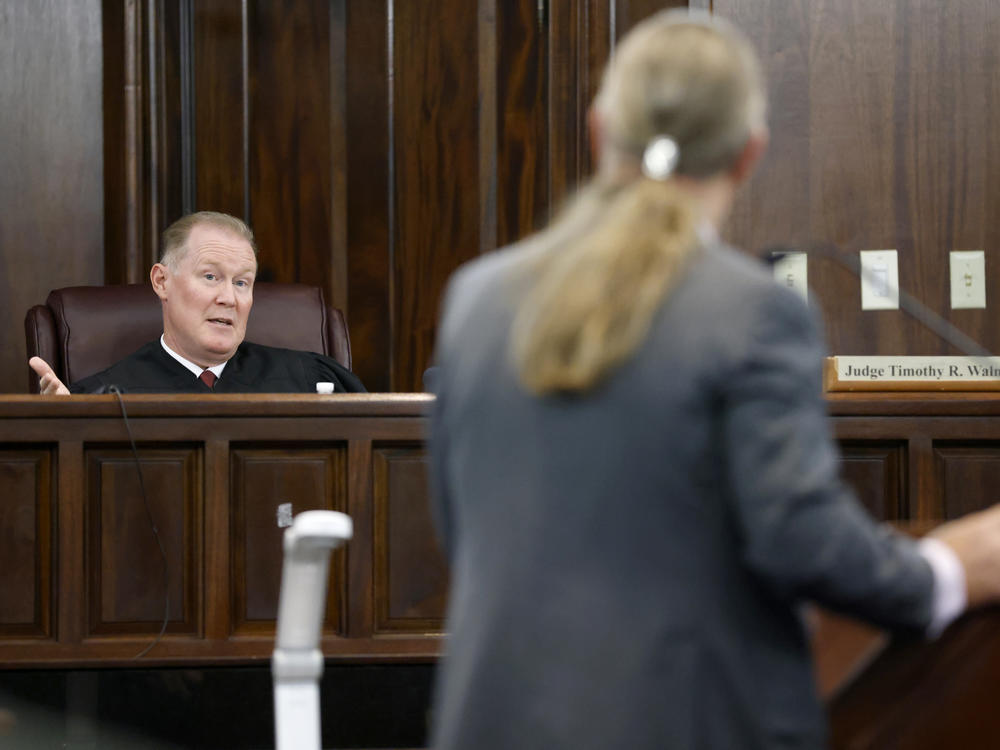 Judge Timothy Walmsley speaks to defense attorney Franklin Hogue during the jury selection process in the trial of the men charged with killing Ahmaud Arbery, at the Glynn County Superior Court in Brunswick, Ga., on Oct. 27.