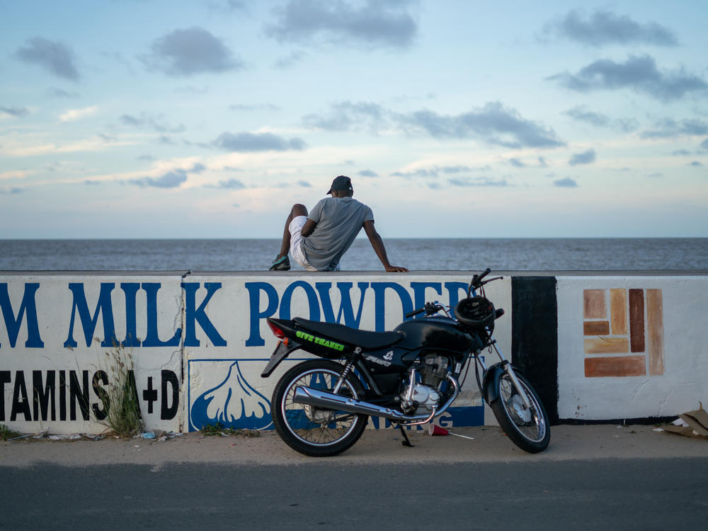 A seawall stretches for hundreds of miles along the coast of Guyana, in northern South America. It protects the low-lying coastal lands where the majority of Guyana's population lives. The region is acutely threatened by rising sea levels, as well as other symptoms of climate change, yet Guyana is embracing the oil industry.