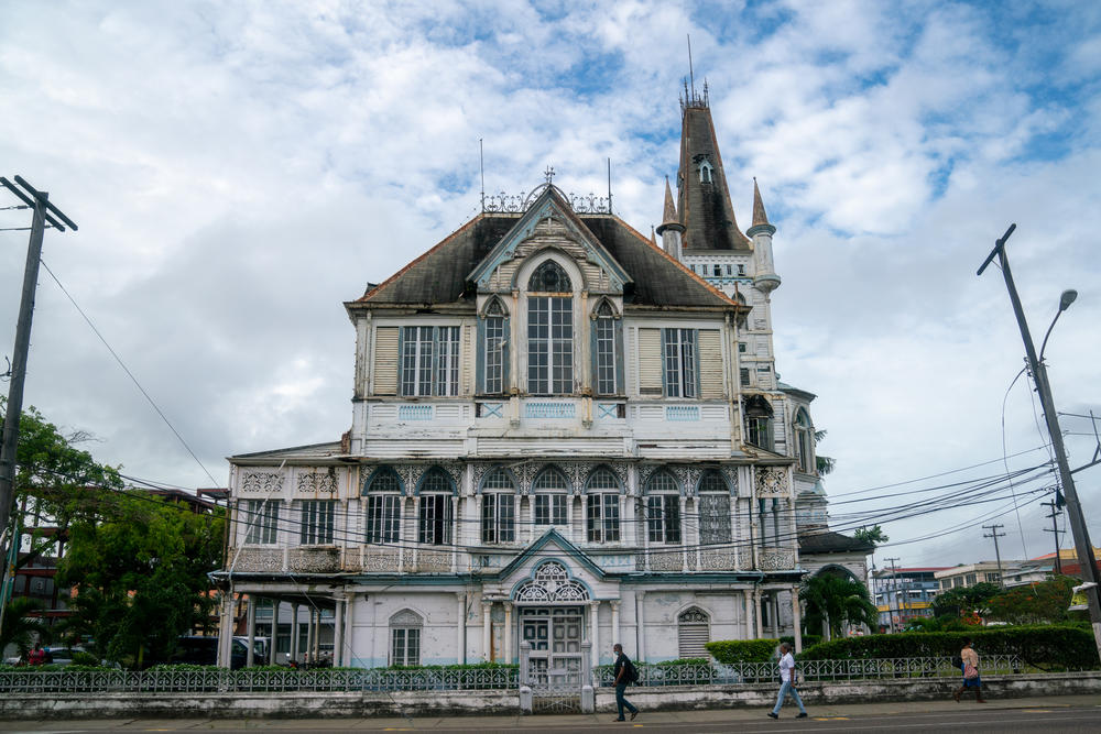 Georgetown's aging city hall was recently scheduled for renovation. The capital city sits on the coast, protected by the seawall.