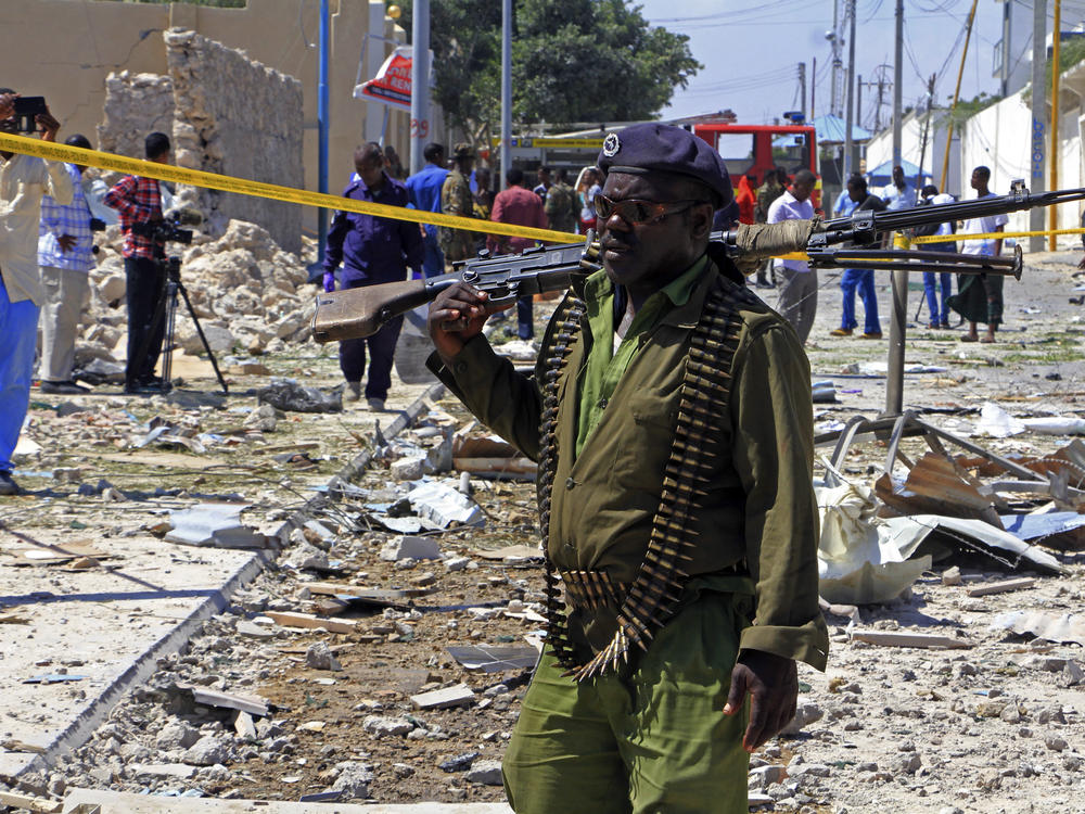 A Somali soldier patrols the area of a suicide car bomb attack in Mogadishu, Somalia, in 2017. The U.S. has been concerned for years about the military's ability to battle al-Qaida-linked militants in the country.