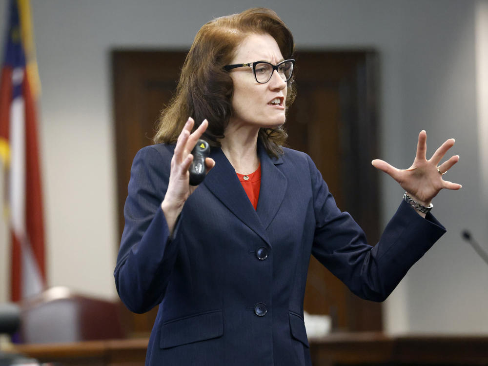 Prosecutor Linda Dunikoski speaks during opening statements in the trial of Gregory McMichael, his son, Travis McMichael, and a neighbor, William 