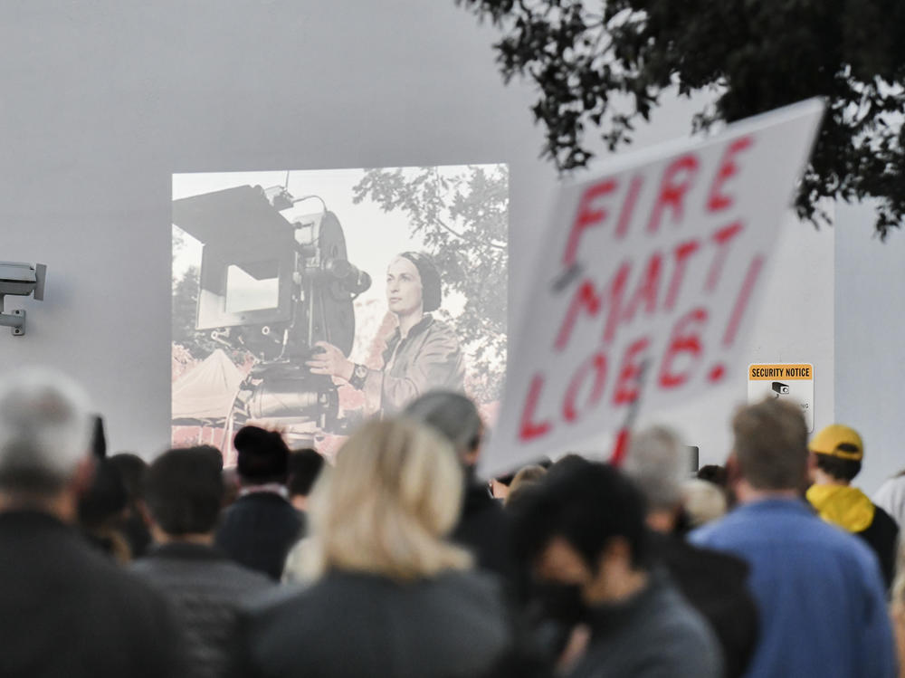 A candlelight vigil is held for Halyna Hutchins at a California IATSE office. Members of the International Alliance of Theatrical Stage Employees union have been pushing for better hours, citing safety concerns, after Hutchins was killed on set.