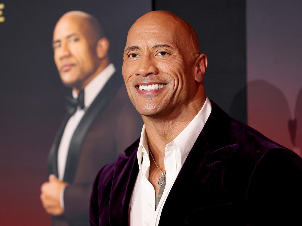 Dwayne Johnson attends the world premiere of Netflix's <em>Red Notice</em> on Wednesday in Los Angeles. Johnson says his production company will no longer use real guns on set.