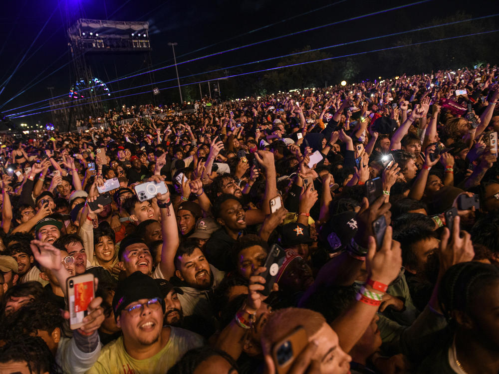 The crowd watches as Travis Scott performs at the Astroworld Festival at NRG park on Friday, in Houston.
