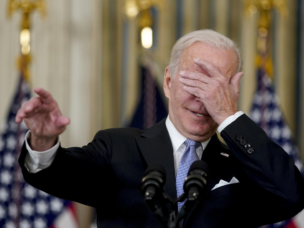 President Biden covers his eyes to choose a reporter to ask a question after speaking about the passage of infrastructure bill.