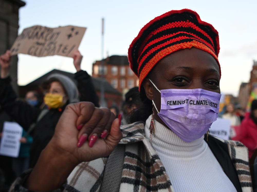 Protesters attend the Global Day of Action for Climate Justice march Saturday in Glasgow, Scotland, where the COP26 conference is being held.