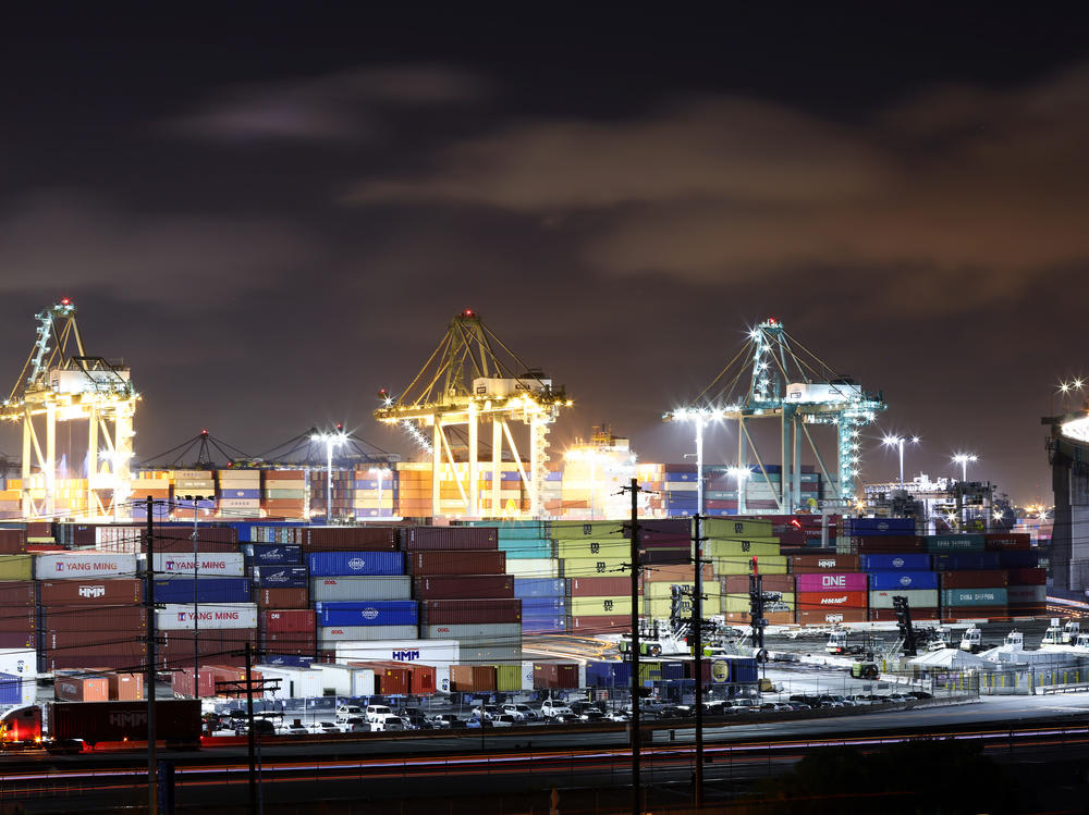 Nighttime operations at the Port of Los Angeles. Strong consumer demand coupled with pandemic workforce shortages have crimped supply chains and caused shortages and delays.