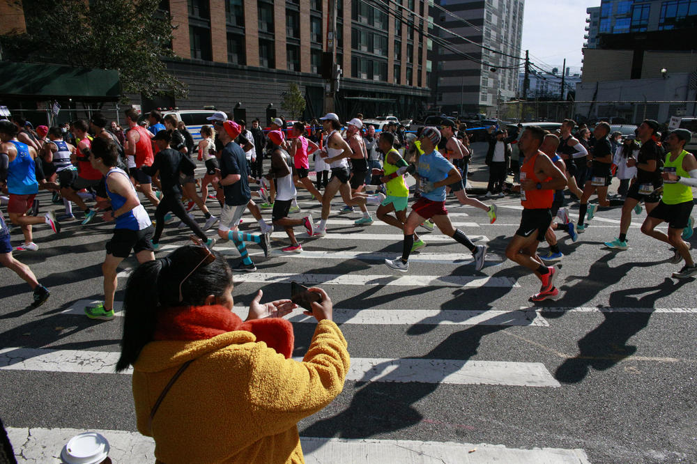 Runners cross the Queens section of the New York City Marathon on Sunday.