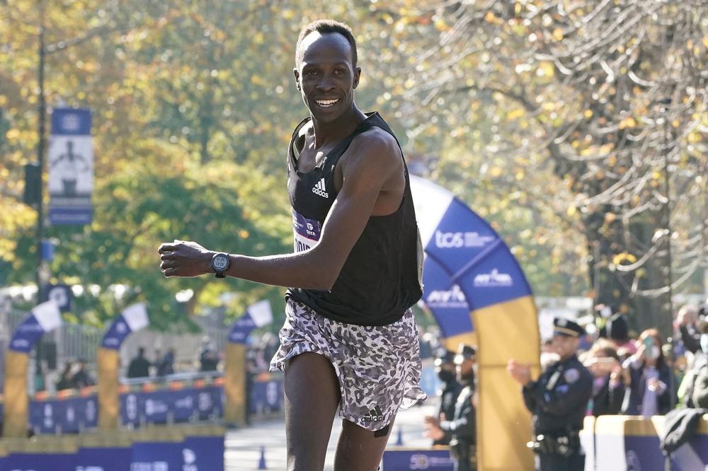 Men's division winner Albert Korir of Kenya crosses the finish line during the 2021 New York City Marathon.