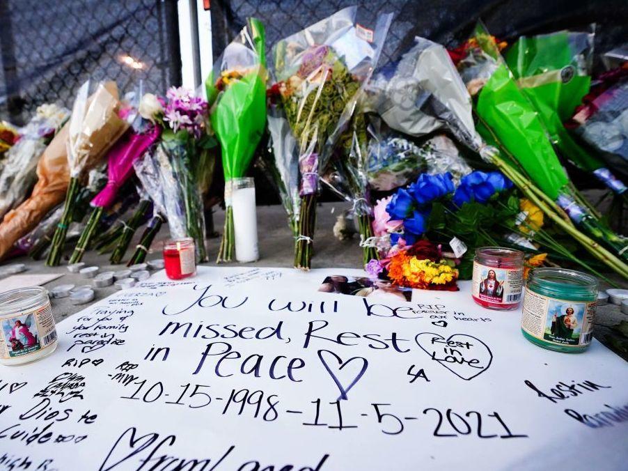 Candles, flowers and letters were placed at a memorial outside the canceled Astroworld music festival at NRG Park in Houston on Sunday.