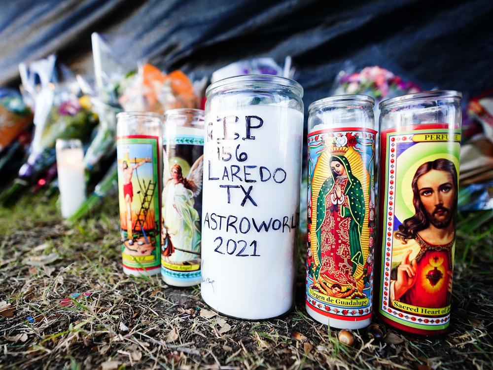 Candles are left outside NRG Park, the site of the deadly Astroworld musical festival in Houston.