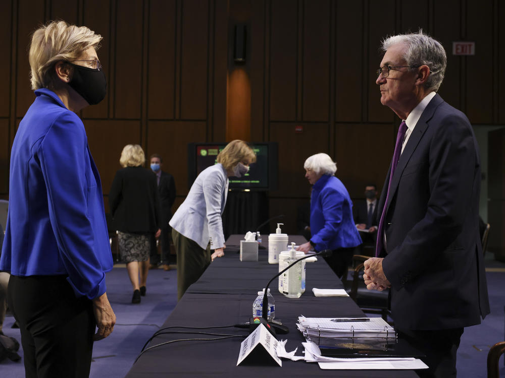Sen. Elizabeth Warren, D-Mass., talks to Federal Reserve Chairman Jerome Powell during a Senate Banking, Housing and Urban Affairs Committee hearing on the CARES Act in Washington, D.C., on Sept. 28. At the hearing, Warren said she is against a second term for Powell as Fed chairman and called him a 